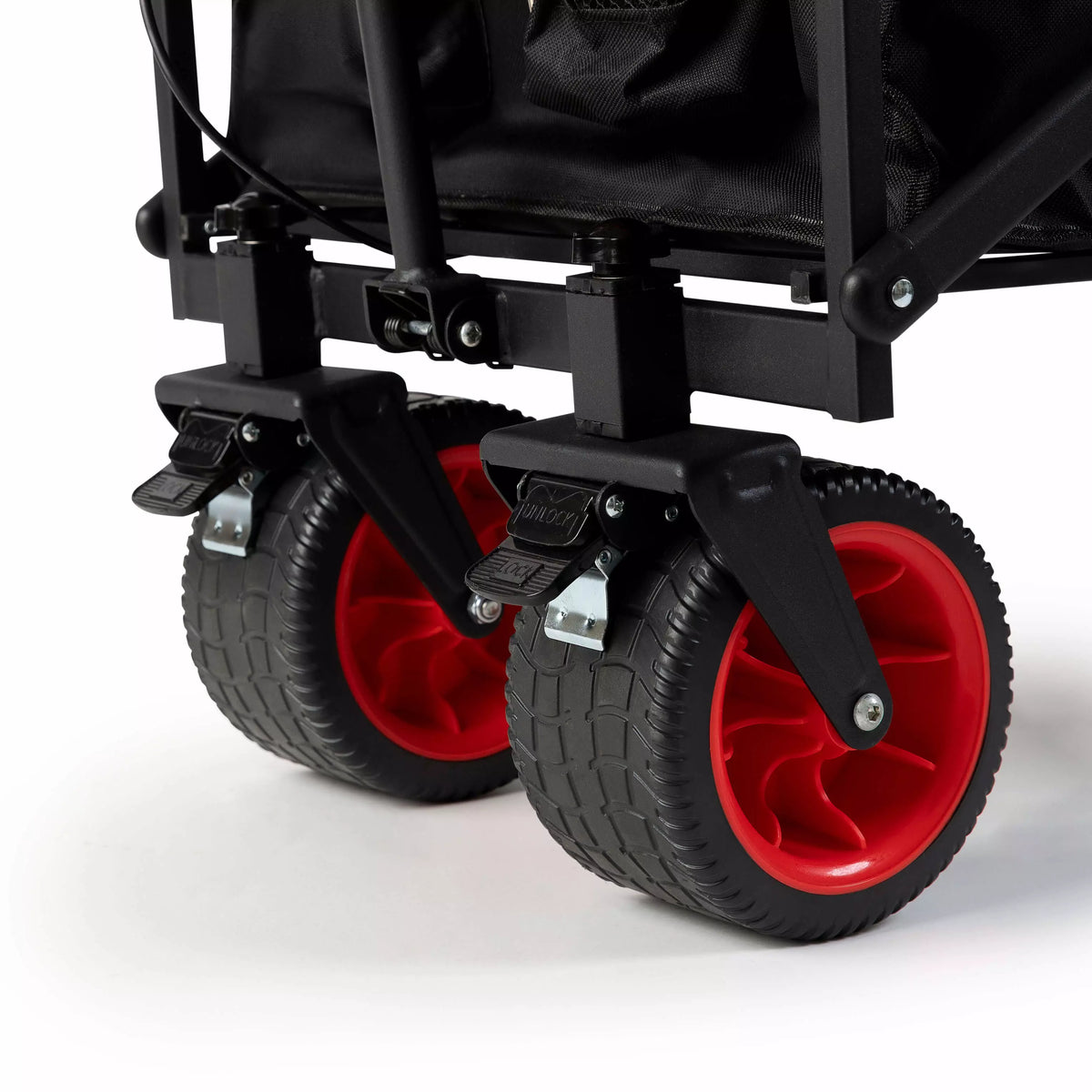 Close-up of a black stroller with red wheels on a white background