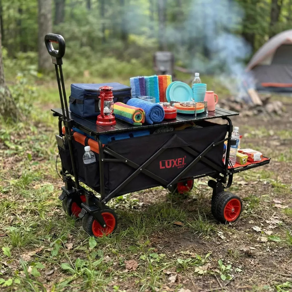 Luxel camping wagon with outdoor gear in a forest setting
